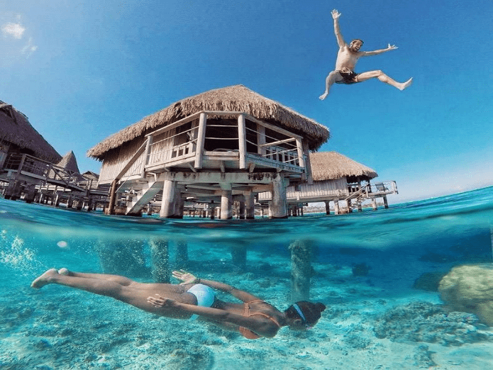 A picture containing sky, water, outdoor, swimming
Description automatically generated